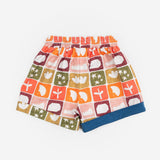 Das Ist Maurice Shorts in Midnight pattern at Cerise. Featuring an exclusive hand-illustrated Midnight Memory print, these kids’ shorts bring an artistic and imaginative feel to a classic everyday style. A contrasting navy drawstring adds a bold finishing detail, while rolled cuffs give the shorts a relaxed, playful look.