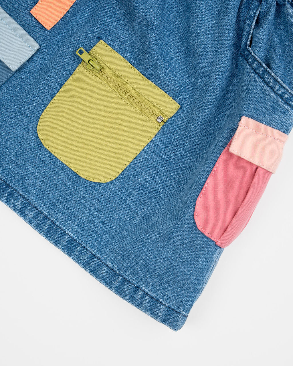 Das Ist Maurice Skirt with Pockets at  Cerise.  Blue Denim Skirt for kids with colourful patch pockets and etail. Elastic waist and drawstring.