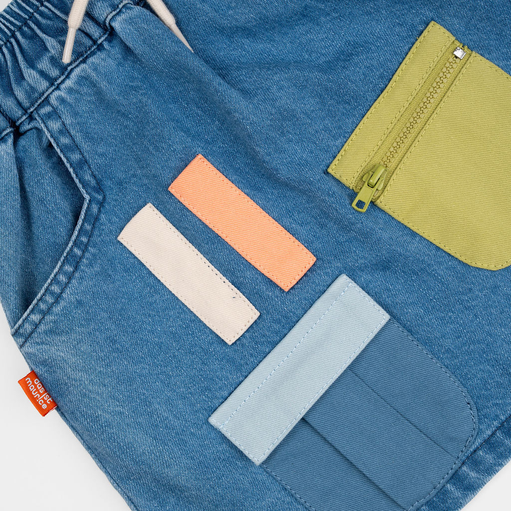 Das Ist Maurice Skirt with Pockets at  Cerise.  Blue Denim Skirt for kids with colourful patch pockets and etail. Elastic waist and drawstring.