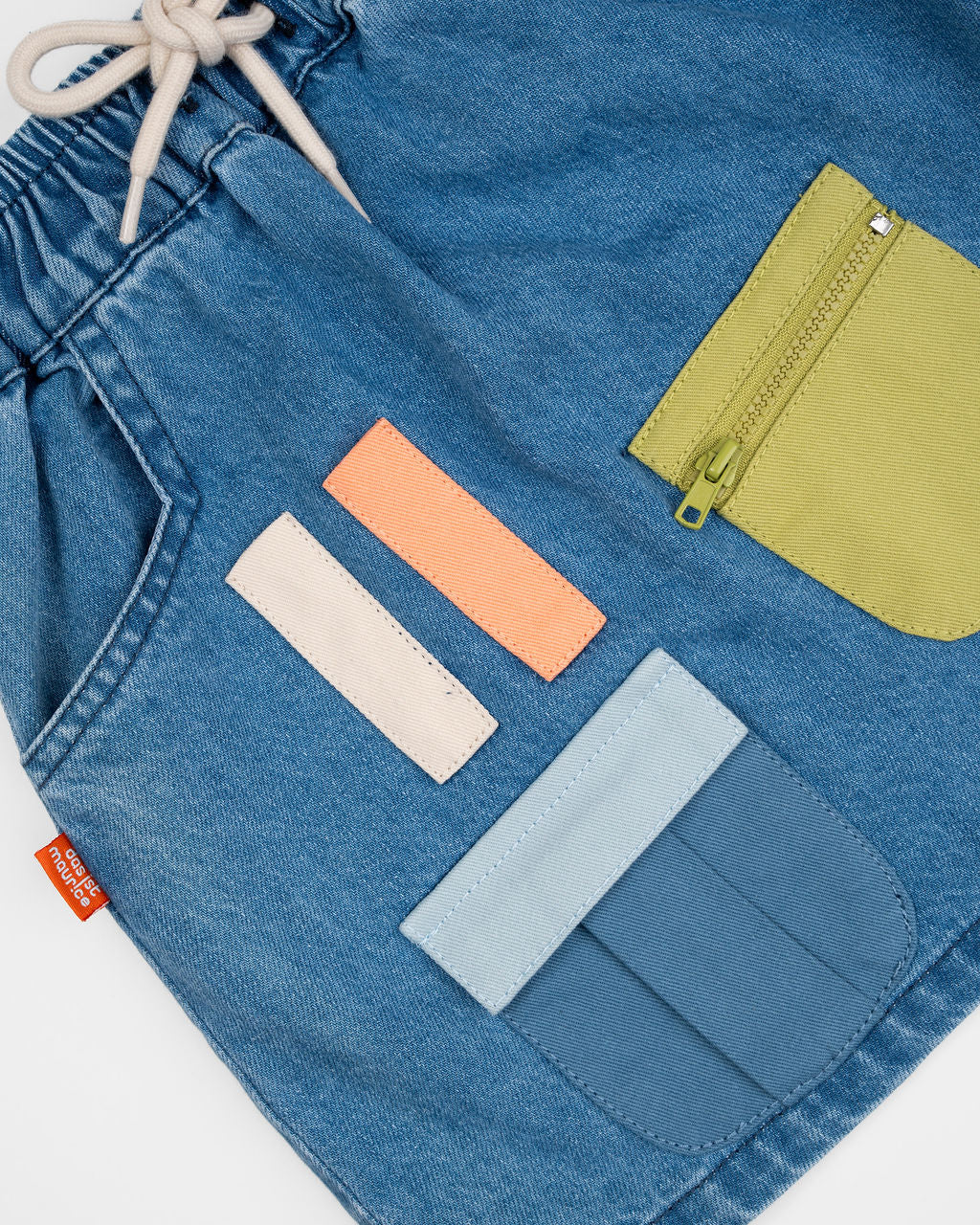 Das Ist Maurice Skirt with Pockets at  Cerise.  Blue Denim Skirt for kids with colourful patch pockets and etail. Elastic waist and drawstring.