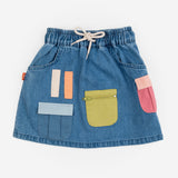 Das Ist Maurice Skirt with Pockets at  Cerise.  Blue Denim Skirt for kids with colourful patch pockets and etail. Elastic waist and drawstring.