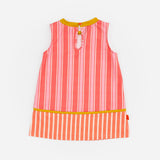 Das Ist Maruice Sleeveless Dress in Coral at Cerise. The relaxed A-line silhouette provides plenty of room for movement, making this sleeveless kids’ dress ideal for active days. Featuring bold coral and peach stripes, the dress has a fun retro-inspired look with a vibrant mustard yellow neckline and contrasting trim