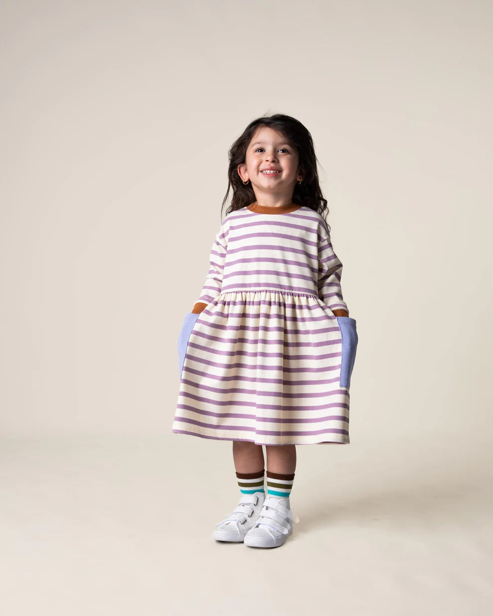Das Ist Maurice Long sleeved Bell dress for young girls in purple and white stripe with blue patch pockets and brown rib neck and cuff trim at cerise nz