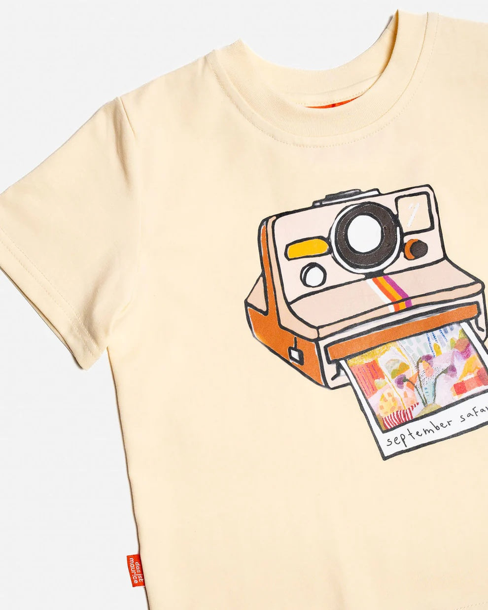 Close up picture of Das Ist Maurice  retro illustrated polaroid t-shirt with a nostalgic photo print on the front featuring our September Safari hand painted abstract artwork at Cerise NZ