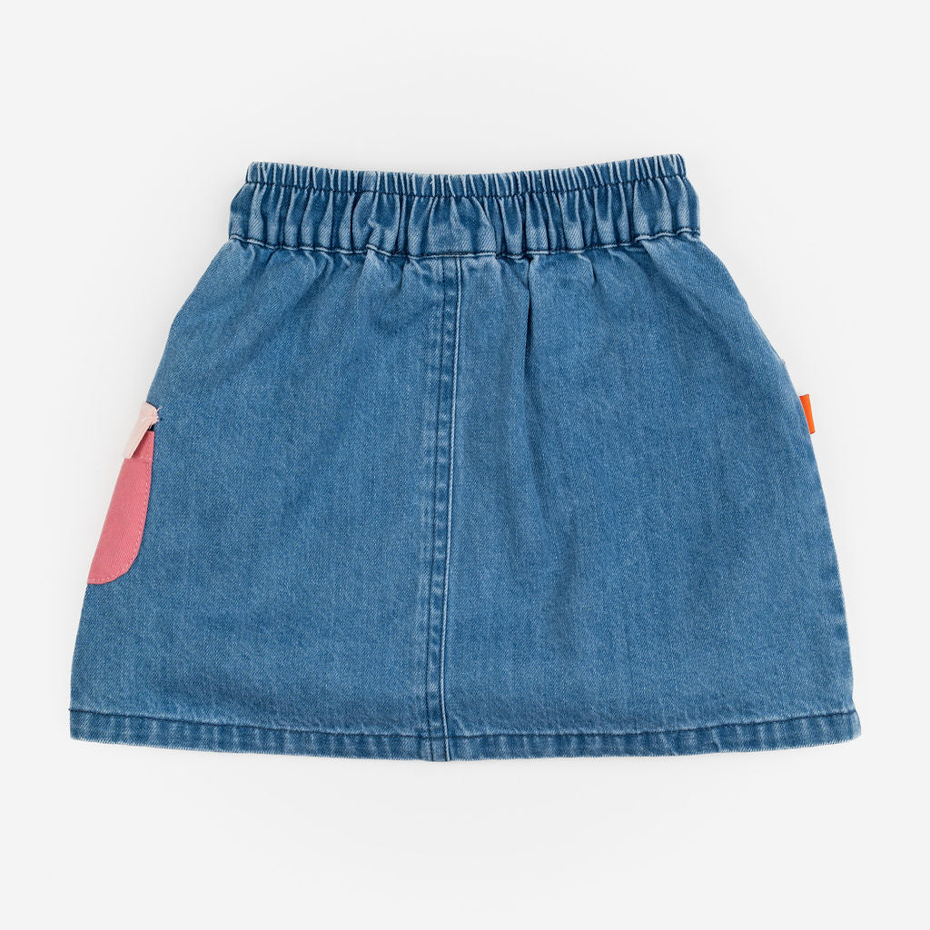 Das Ist Maurice Skirt with Pockets at  Cerise.  Blue Denim Skirt for kids with colourful patch pockets and etail. Elastic waist and drawstring.