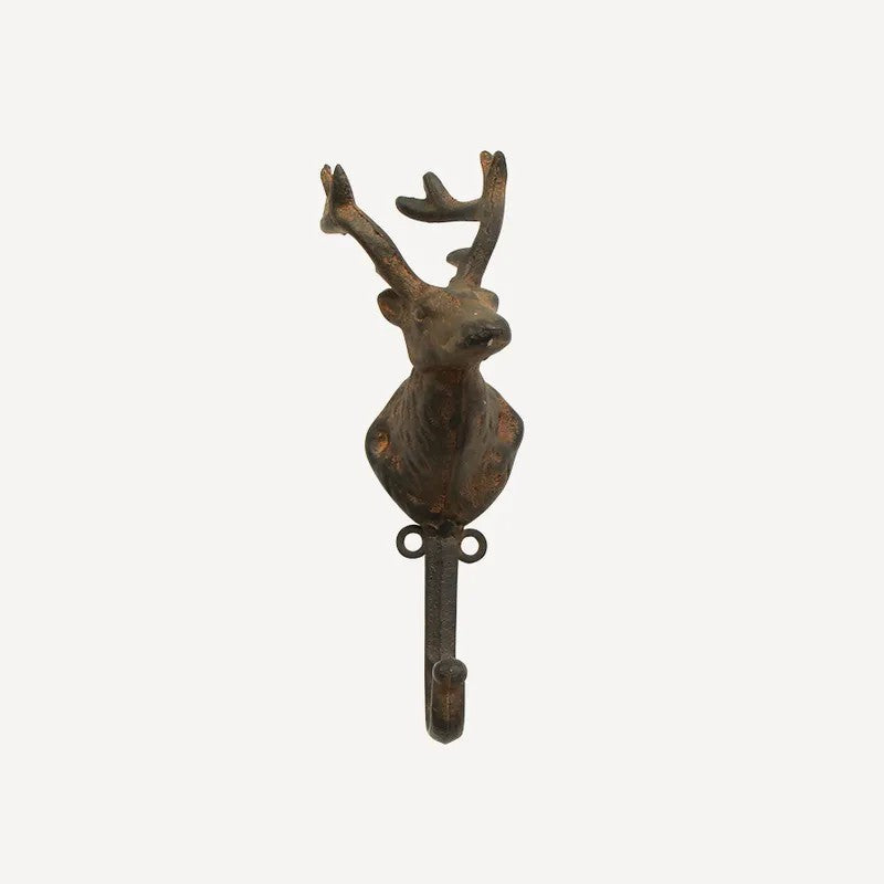 Decorative wall hook shaped like a deer head on a white background