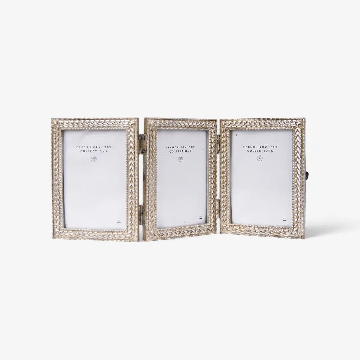 Triple photo frame with decorative antique silver decoractive border on a white background