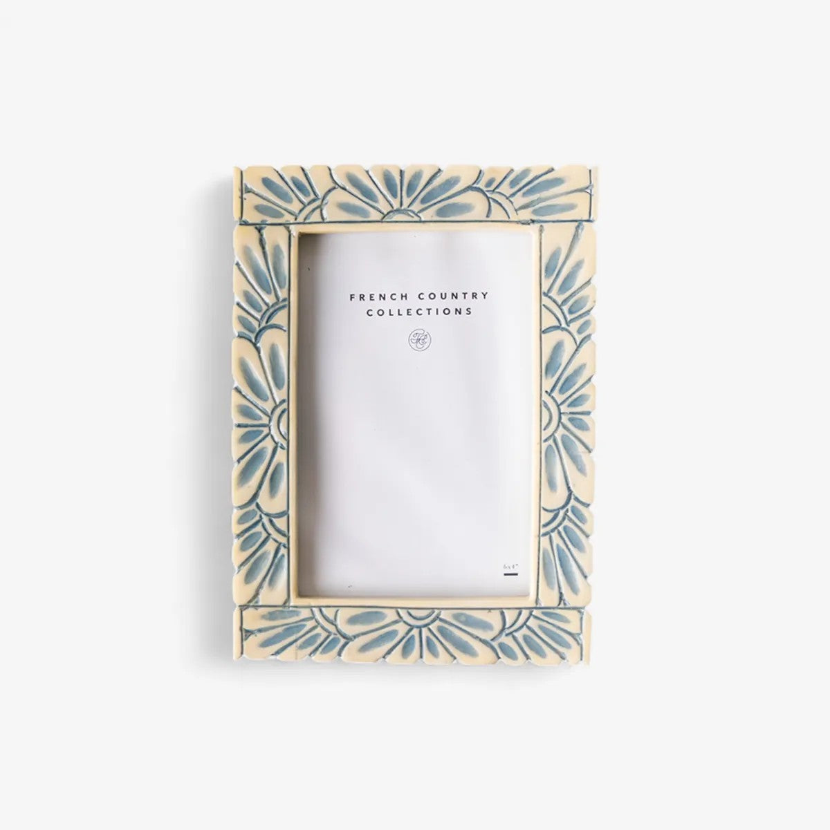 Decorative picture frame with blue  floral pattern on an off white background
