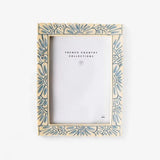 Decorative picture frame with blue  floral pattern on an off white background