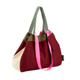 Dark red and cream canvas bag with green straps