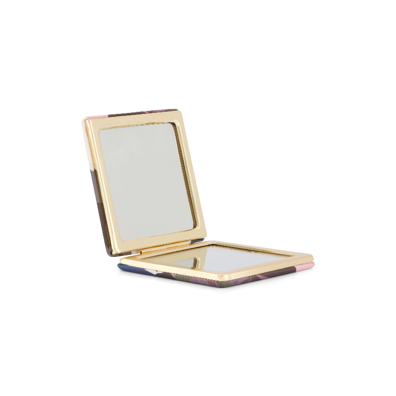 Flox compact mirror in flox distinctive artwork. Opens up to one regular mirror and one magnifying mirror,, Presented in a gift box