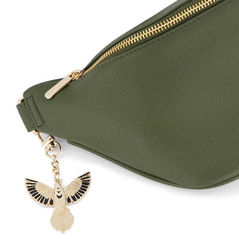 FLOX AHI belt bag in green earthy toned textured vegan leather with flox designed satin interior lining and two staps.  Gold Tui Charm