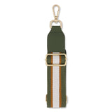FLOX AHI belt bag in green earthy toned textured vegan leather with flox designed satin interior lining and two staps.  Gold Tui Charm