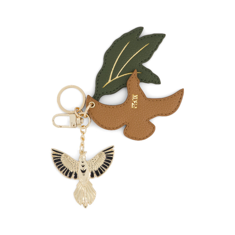Flox Keycharm featuring a gold coloured metal tui and vegan leather tui and leaf in gift box
