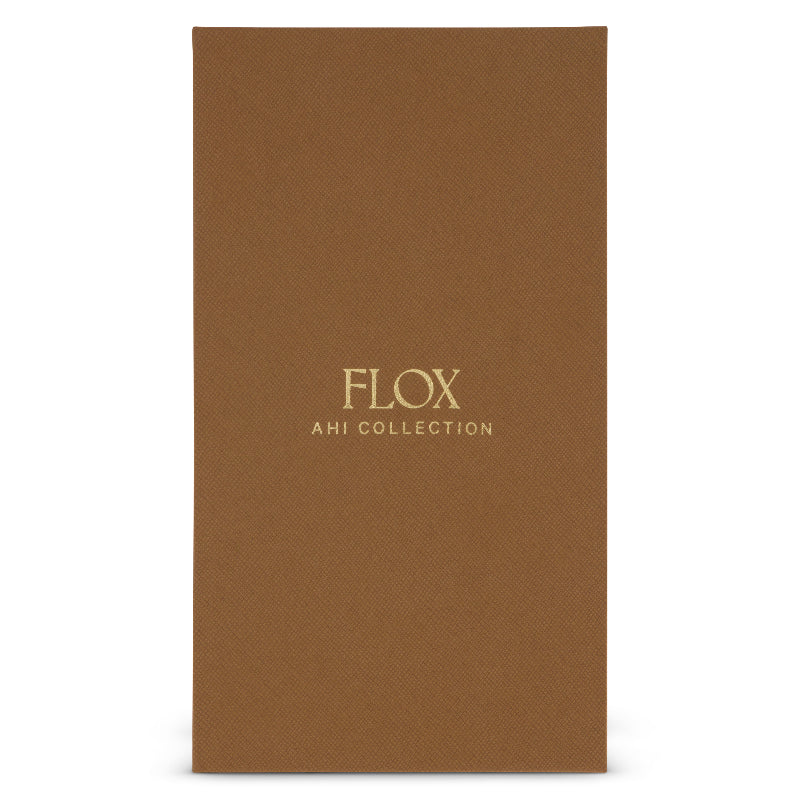 Flox Keycharm featuring a gold coloured metal tui and vegan leather tui and leaf in gift box