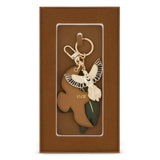 Flox Keycharm featuring a gold coloured metal tui and vegan leather tui and leaf in gift box