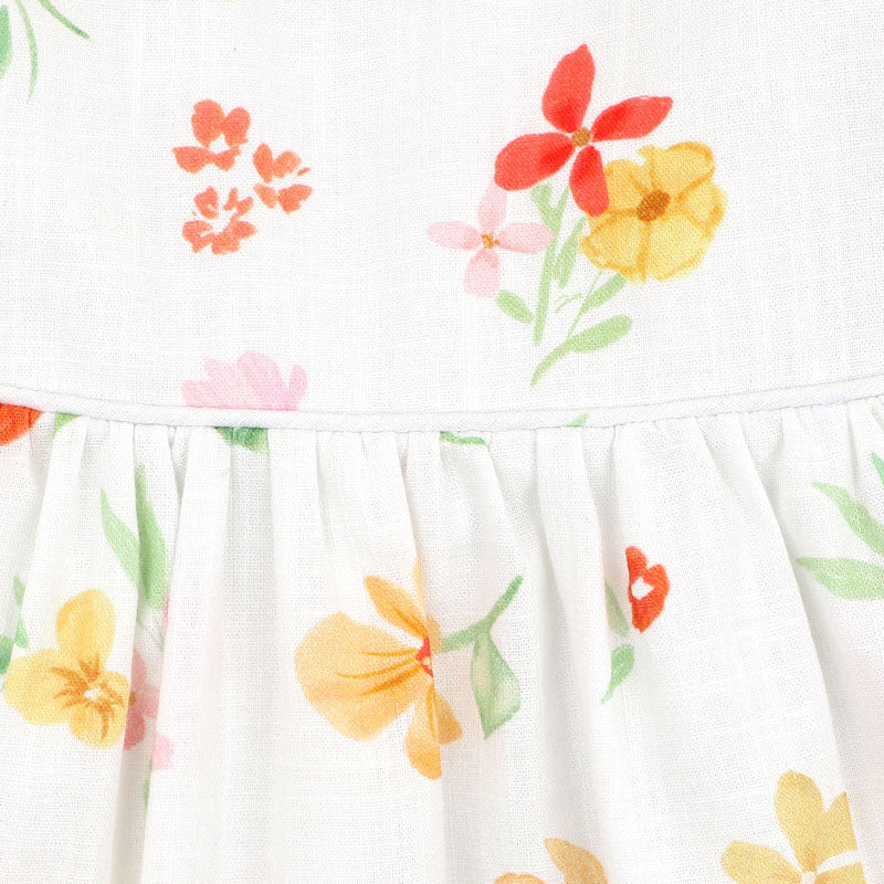 Floral print on white background with puff sleeves for baby