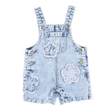 Light blue denim overalls with frayed edge decorative floral patches