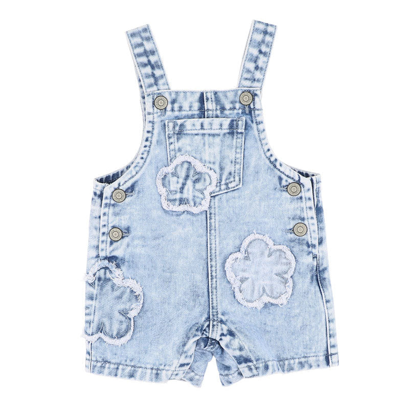 Light blue denim overalls with frayed edge decorative floral patches