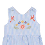 Blue striped dress with floral and starfish embroidery on a white background