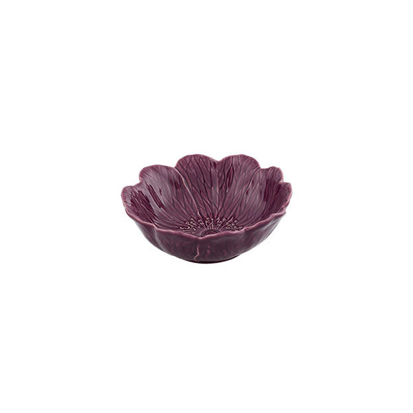 Purple ceramic bowl with a textured surface on a white background