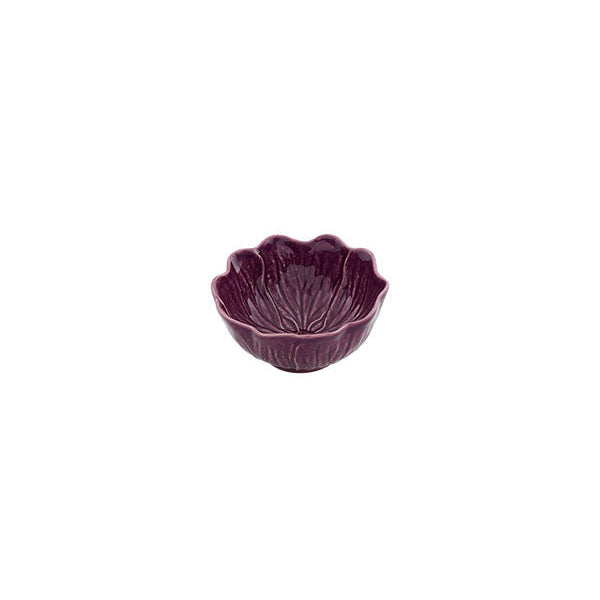 Purple ceramic bowl with scalloped edge on a white background