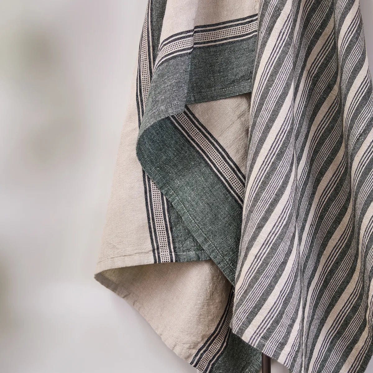 French Country Collections Atelier Ribbon Teatowel in Green at Cerise.  Made from a practical cotton linen blend and has a hang tag.