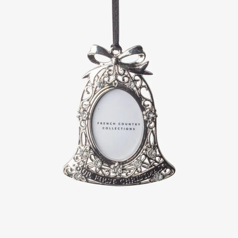 French Country baby’s first Christmas hanging photo frame ornament at Cerise. Featuring an elegant bell shape with delicate detailing and crystal-style accents, it holds a small photo and hangs from a ribbon—perfect for a Christmas tree or nursery keepsake. 
Measures  7.1cmLx9cmWx0.5cmH
