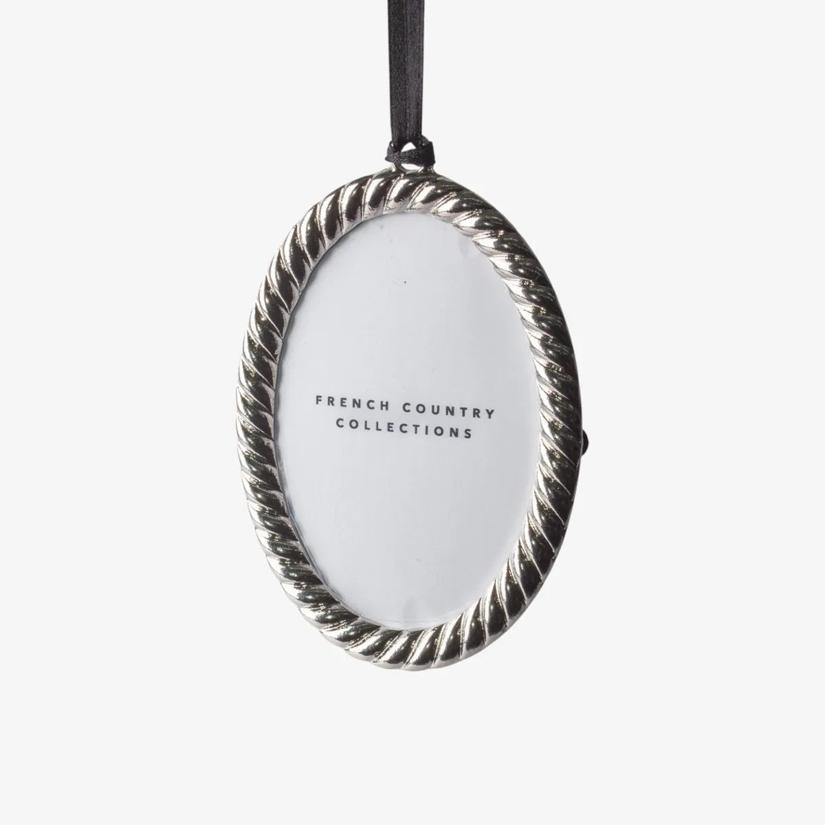 From French Country,  A classic silver rope designed edge frame at Cerise. This beautiful oval frame is a timeless keepsake for showcasing treasured memories year after year.

Measures 6.4cmLx9.4cmWx1cmH
