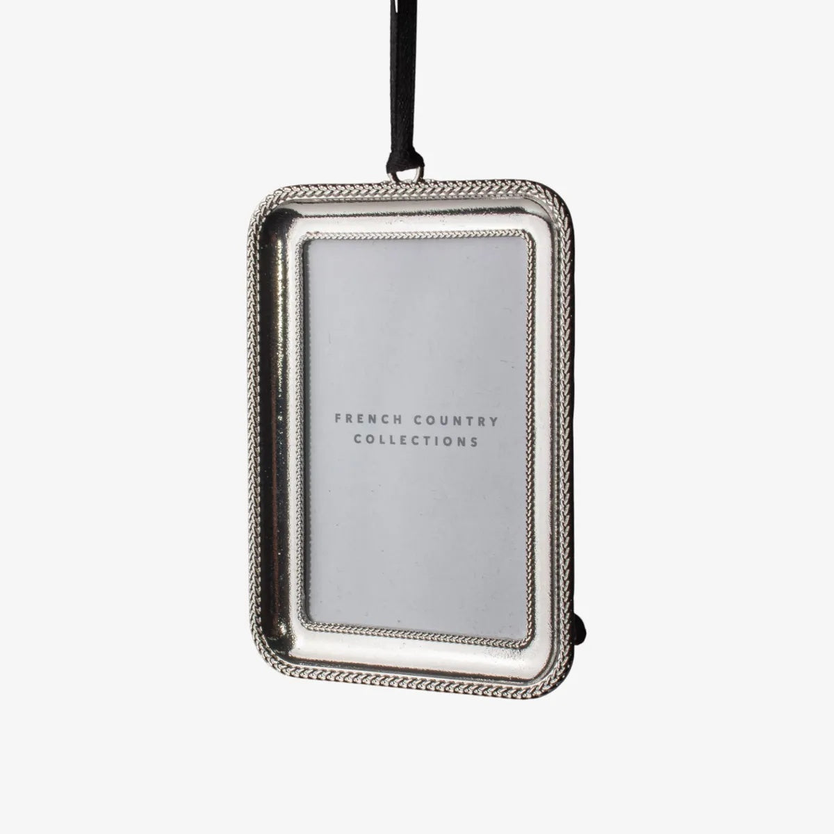 A French Country classic silver beaded rectangular frame at Cerise,  which holds a small photograph and hangs from a ribbon. A timeless keepsake for showcasing treasured memories year after year.  Measures 7.8cmLx8.4cmWx1cmH
