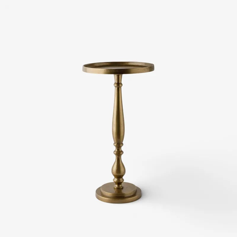 The Barnes Side Table by French Country Collections at Cerise brings timeless elegance to your room with its graceful curved base and practical lipped tabletop.

Made from metal and finished in  antique gold patina, this versatile piece complements both traditional and contemporary interiors, making it the perfect accent beside a sofa, armchair, or bed.

Measures 26cm (L) × 26cm (W) × 50cm (H)
