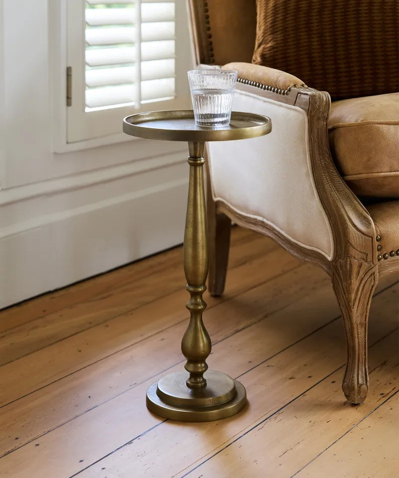 The French Country Collections Barnes side Table at Cerise brings timeless elegance to your room with its graceful curved base and practical lipped tabletop.

Made from metal and finished in  antique gold patina, this versatile piece complements both traditional and contemporary interiors,  ideal to sit alongside an armchair or sofa.

Measures 26cm (L) × 26cm (W) × 50cm (H)