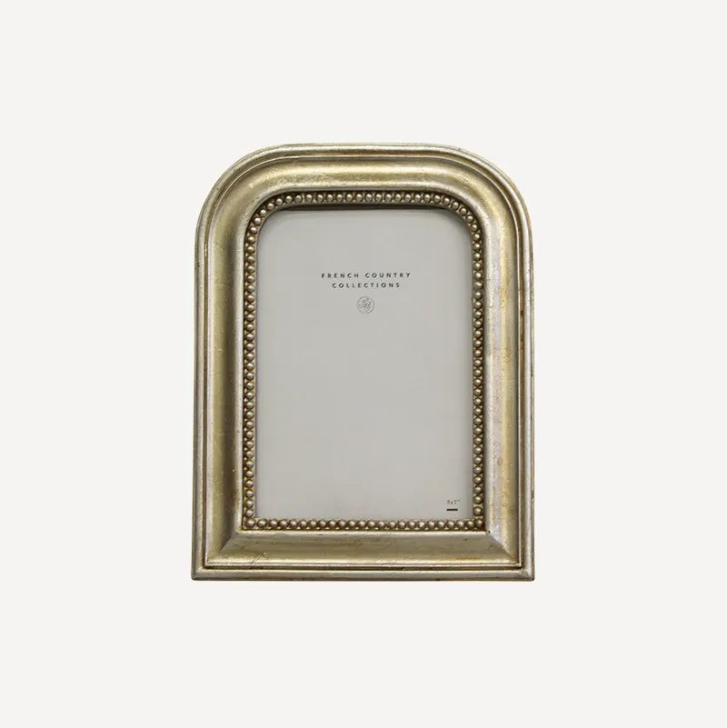 French Country Beaded Arch Photo Frame at Cerise.  Holds a 5 x 7 inch photo . Gold and silver tones with beaded detail.