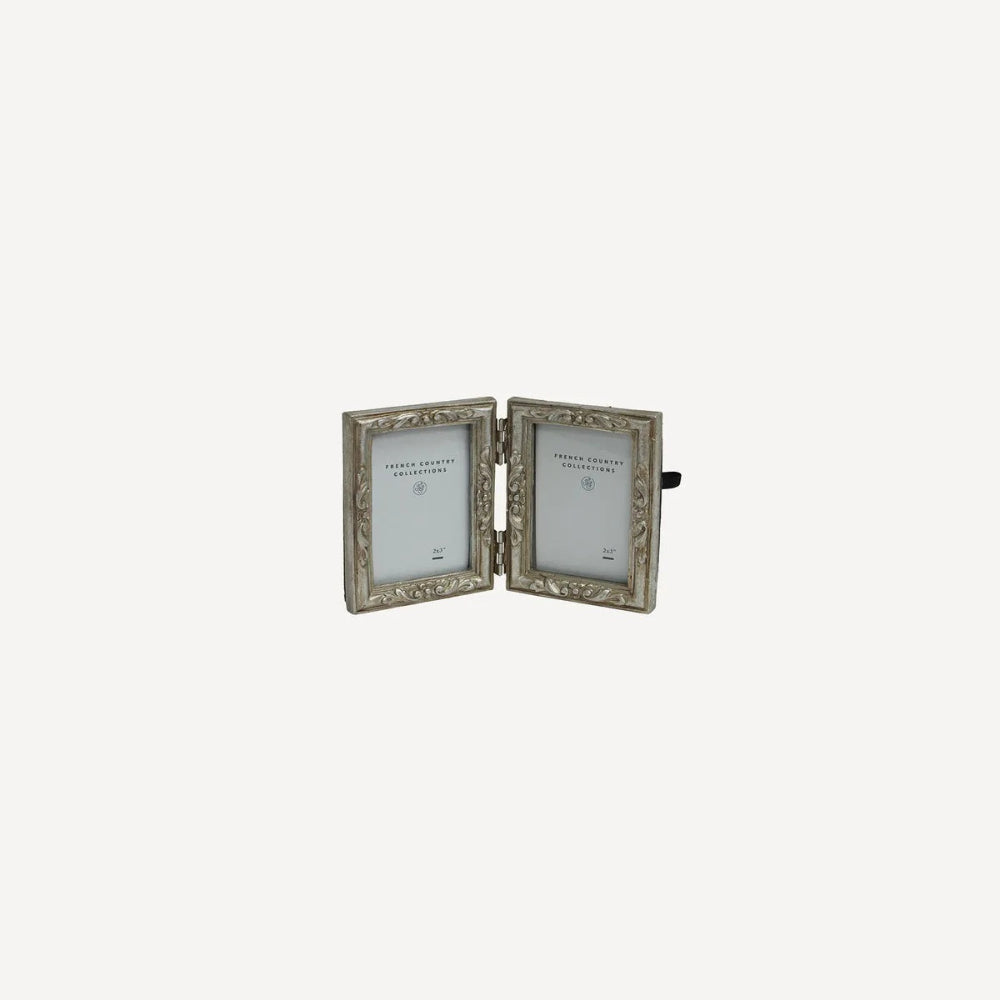 French Country Emma double photo frame at Cerise.  Holds 2 size 2 x 3 inch  photos.   Minished in a silver colour with flower motifs.