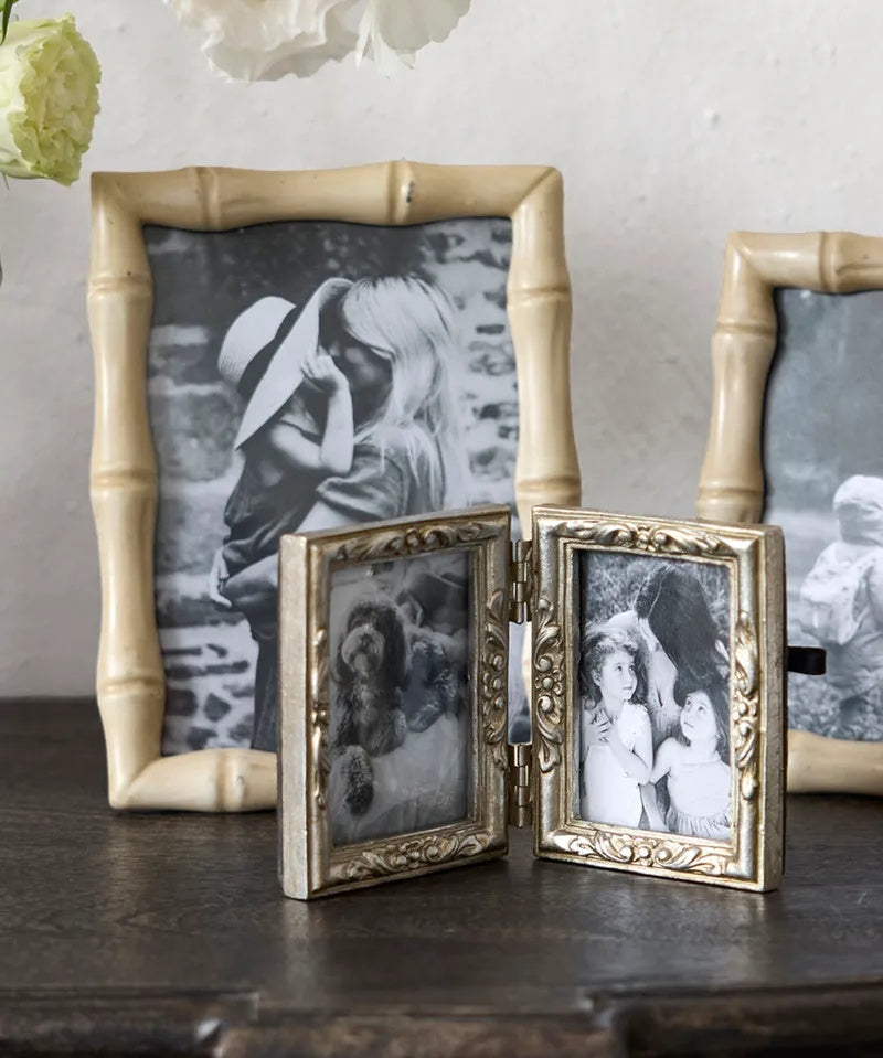 French Country Emma double photo frame at Cerise.  Holds 2 size 2 x 3 inch  photos.   Minished in a silver colour with flower motifs.