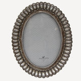 French Country Fanned Oval Photo Frame at Cerise.  Finished in a pewter colour and it holds a 5 x 7 inch photo