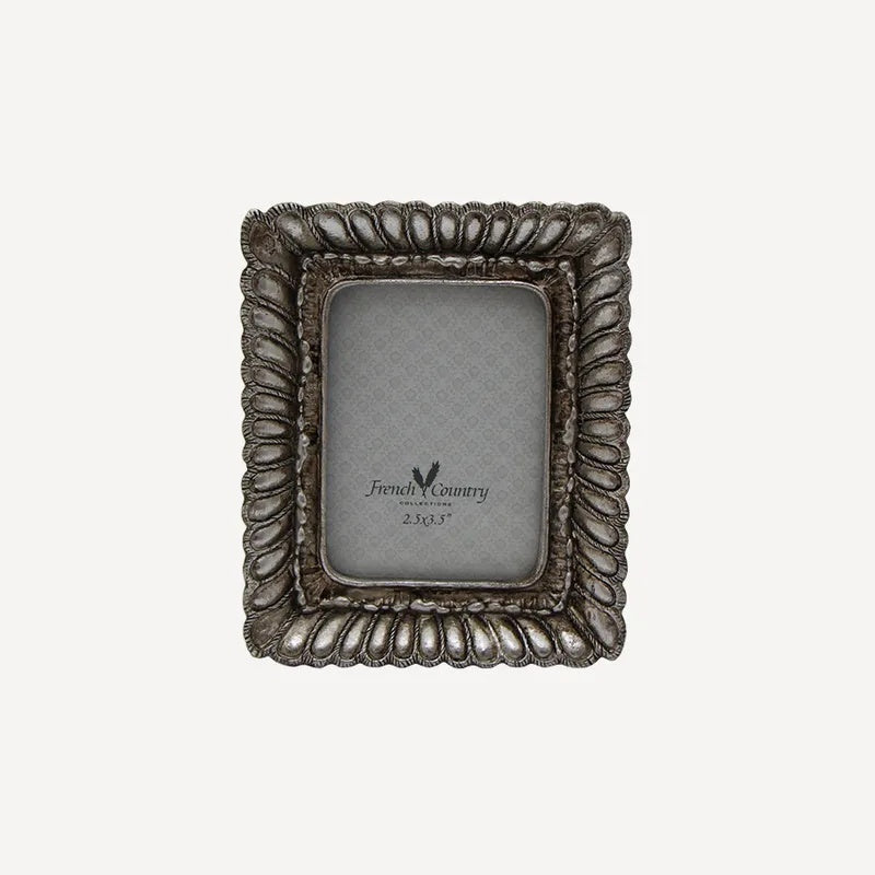 French Country small fanned silver photos frame at Cerise.  Holds a 2.5 x 3.5 inch photo.