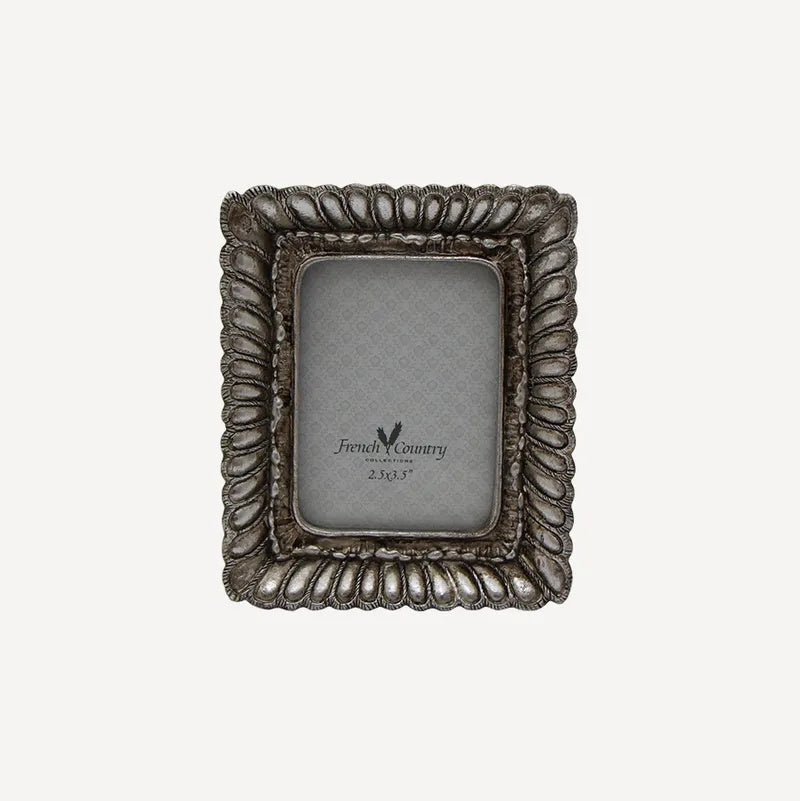 French Country small fanned silver photos frame at Cerise.  Holds a 2.5 x 3.5 inch photo.