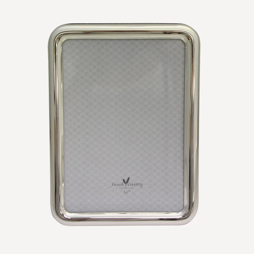French Country Collections Oslo Silver Photo Frame at Cerise.  Takes a 5 x 7 inch photo and  its narrow profile with curved edges sits well with other frames in a collection.