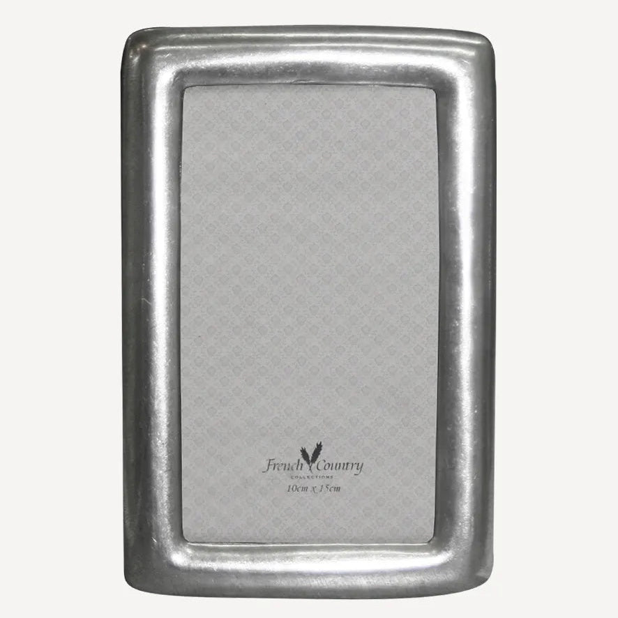 French Country Collections rounded pewter frame at Cerise.  Made of genuine solid pewter, takes a 4 x 6 inch photo.