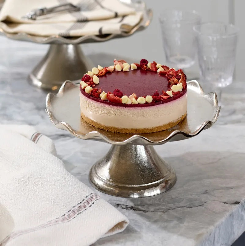 A stunning French Country Collections design with a graceful silhouette and flared pedestal base, the Small Aster Cake Stand is perfect for displaying cakes, pastries, cheeses, or fresh fruit.

Use a liner if serving food directly on the surface.

Dimensions: 29cm (L) × 29cm (W) × 12cm (H)