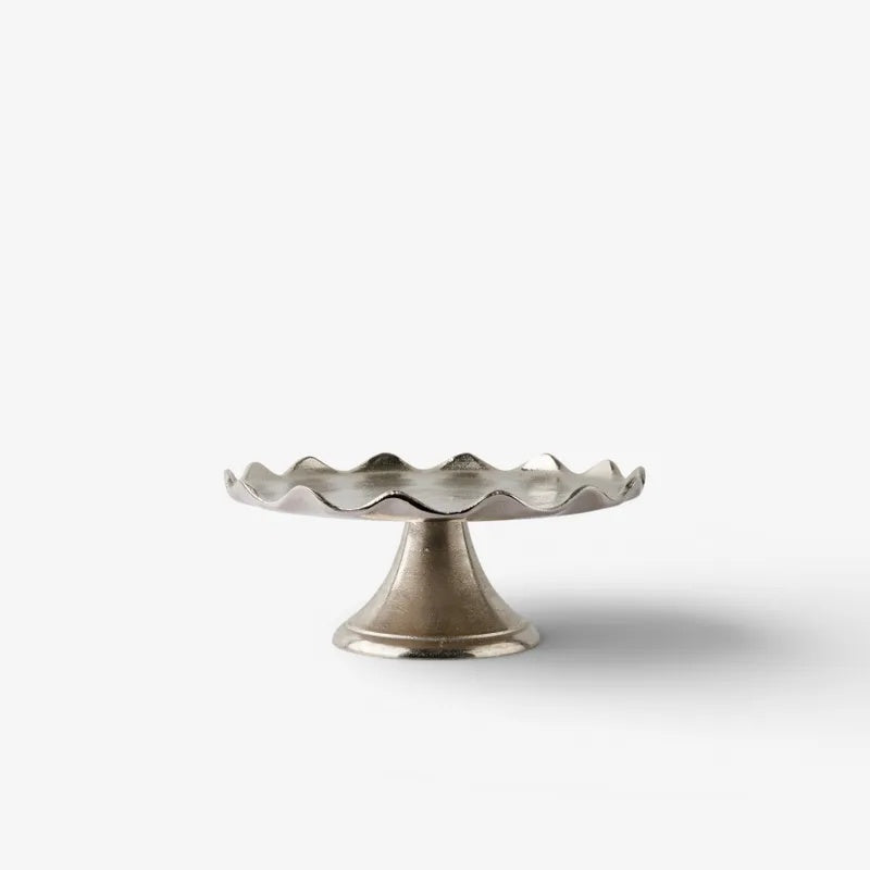 From French Country Collections the Small Aster Cake Stand at Cerise has a beautiful flared bedestal base and is perfect for displaying cakes, pastries, cheeses, or fresh fruit.

Both practical and decorative, it adds an elegant touch to everyday entertaining and special occasions alike.

Use a liner if serving food directly on the surface.

Dimensions: 29cm (L) × 29cm (W) × 12cm (H)