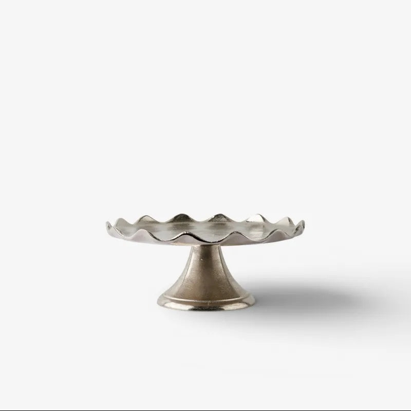 From French Country Collections the Small Aster Cake Stand at Cerise has a beautiful flared bedestal base and is perfect for displaying cakes, pastries, cheeses, or fresh fruit.

Both practical and decorative, it adds an elegant touch to everyday entertaining and special occasions alike.

Use a liner if serving food directly on the surface.

Dimensions: 29cm (L) × 29cm (W) × 12cm (H)
