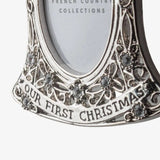 French Country baby’s first Christmas hanging photo frame ornament at Cerise. Featuring an elegant bell shape with delicate detailing and crystal-style accents, it holds a small photo and hangs from a ribbon—perfect for a Christmas tree or nursery keepsake. 
Measures  7.1cmLx9cmWx0.5cmH