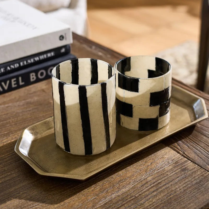 
This decorative Hex tray from French Country and at Cerise is perfect for styling candles, displaying perfumes, organising everyday essentials, or creating a beautiful centrepiece. Made from antique gold finished aluminium.