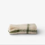 French Country Juniper check Throw in Green at Cerise.  Feauturing green check stripes on a neutal backound and tassle ends. Great for the end of the bed or sofa or simply to snuggle up in.