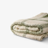 French Country Juniper check Throw in Green at Cerise.  Feauturing green check stripes on a neutal backound and tassle ends.