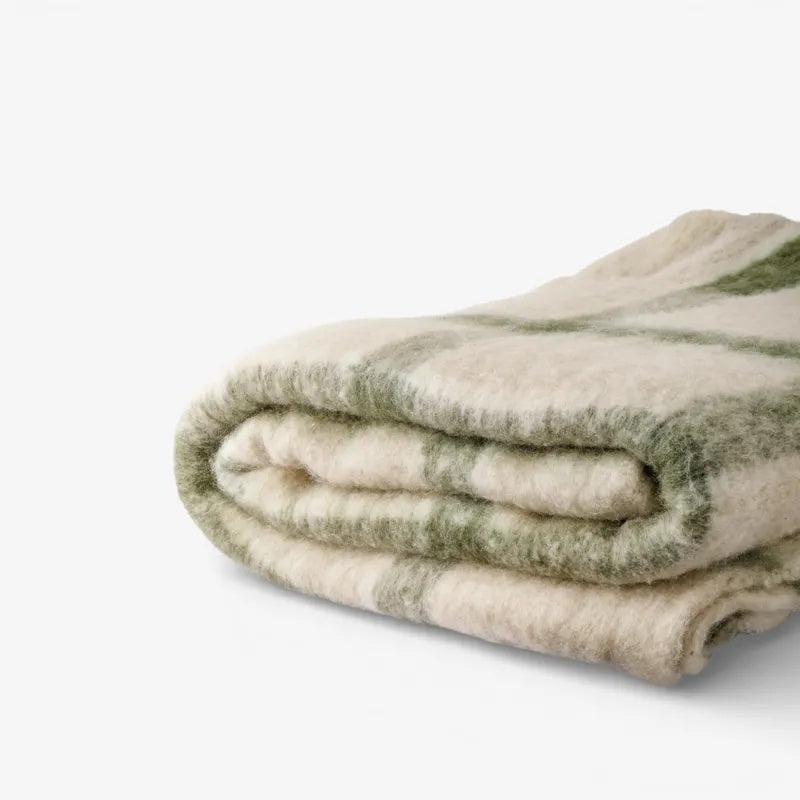 French Country Juniper check Throw in Green at Cerise.  Feauturing green check stripes on a neutal backound and tassle ends.