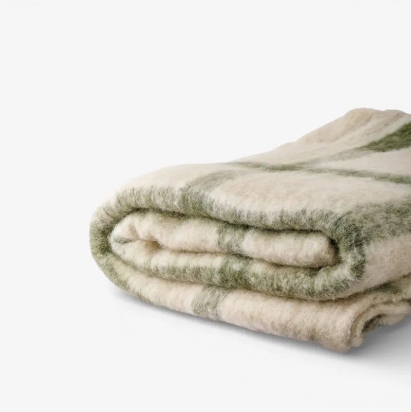 French Country Juniper check Throw in Green at Cerise.  Feauturing green check stripes on a neutal backound and tassle ends.