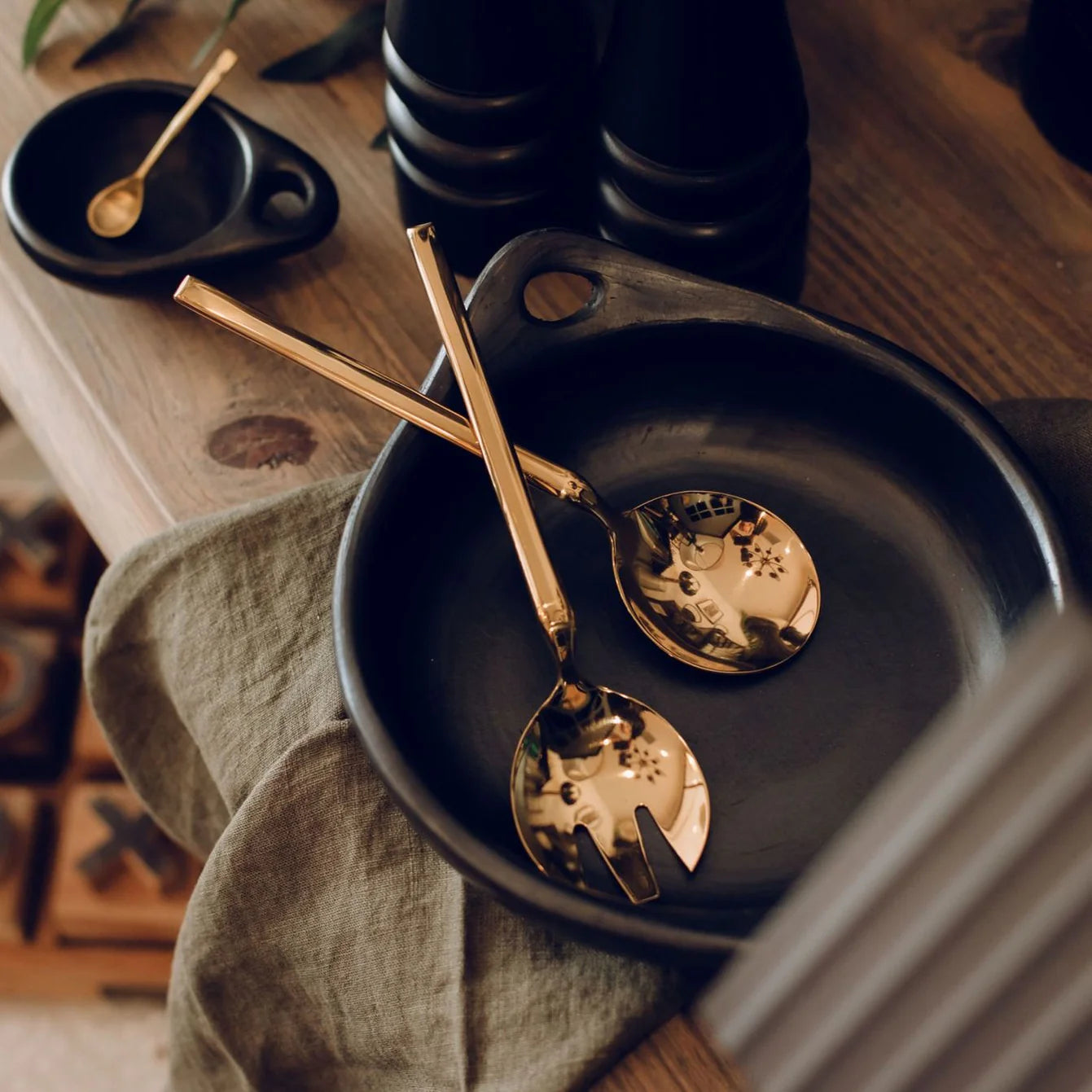 Gold salad servers in titanium plated stainless steel by Broste